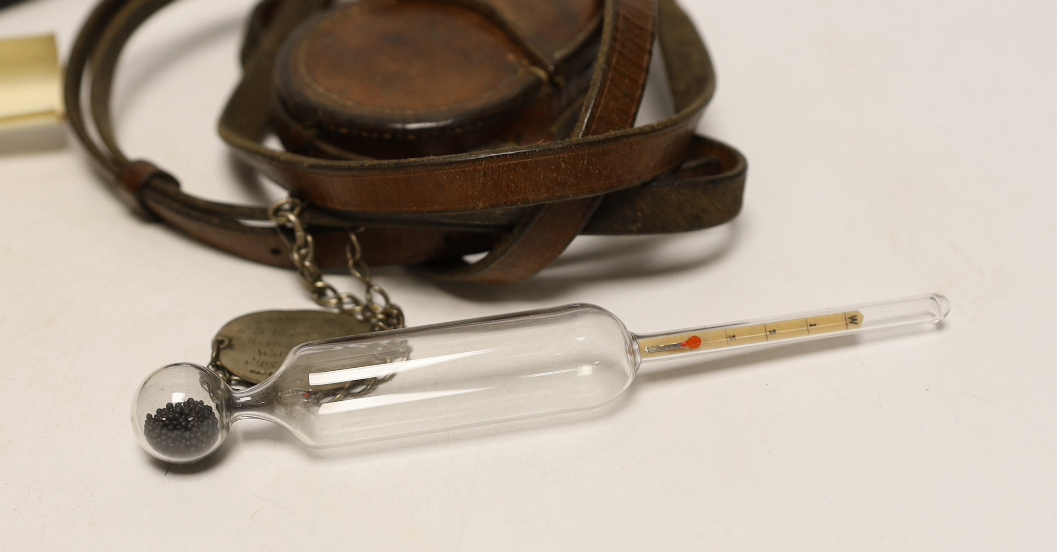 A WWI compass and two medical hydrometers